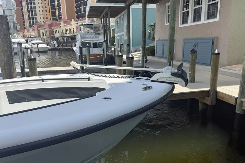 Slide: The Image of 2023 Yellowfin 26 Hybrid boat docked at marina with MotorGuide trolling motor. - 39
