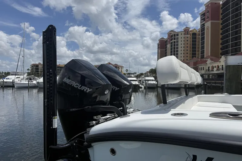 Slide: The Image of 2023 Yellowfin 26 Hybrid boat with Mercury engines docked at marina. - 5
