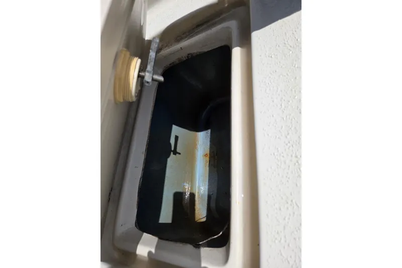 Slide: The Image of 2017 Carolina Skiff 198 DLX boat compartment with latch detail. - 11