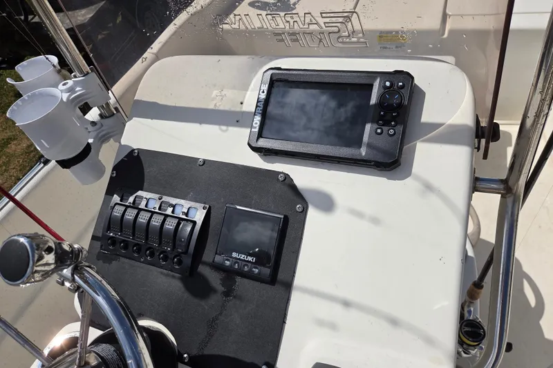 Slide: The Image of Control panel of a 2017 Carolina Skiff 198 DLX boat with navigation equipment. - 12