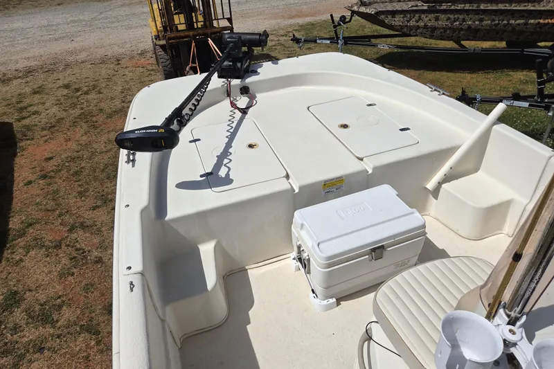 Slide: The Image of 2017 Carolina Skiff 198 DLX boat deck with cooler and trolling motor. - 18