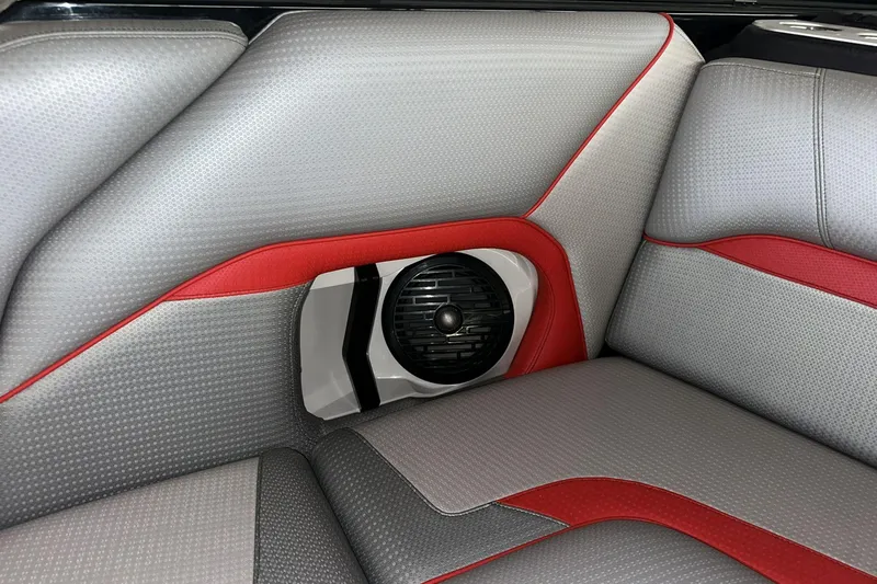 Slide: The Image of 2021 Centurion Ri245 interior with gray and red upholstery, featuring a built-in speaker. - 14