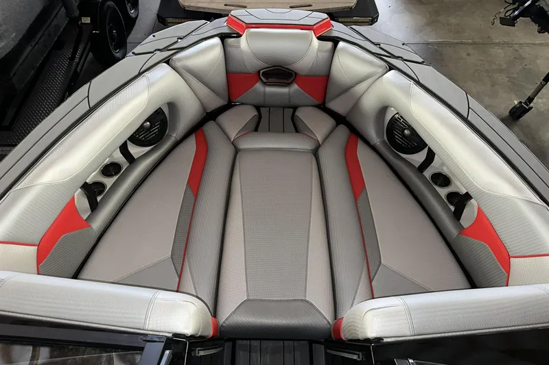 Slide: The Image of Luxurious interior of 2021 Centurion Ri245 boat with gray and red seating. - 16