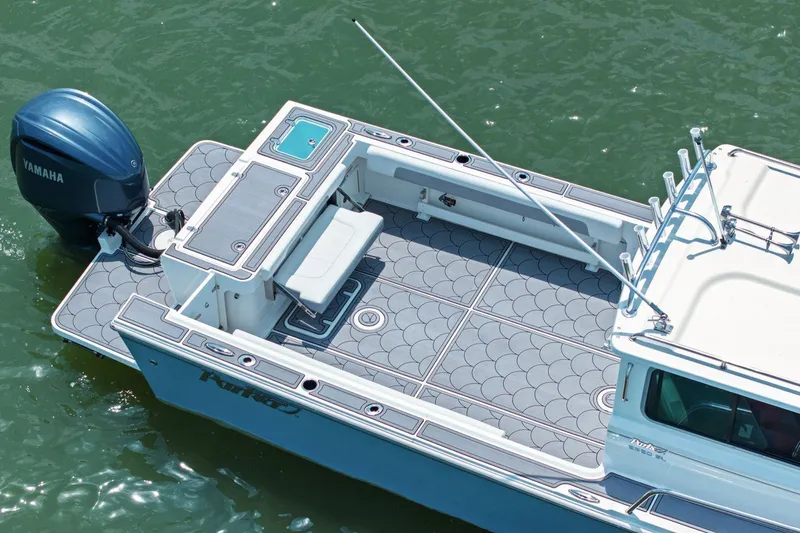 Slide: The Image of Parker 2320 Sport Cabin 2024 with Yamaha engine on calm water. - 10