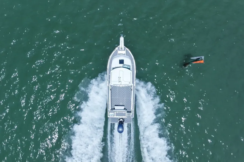 Slide: The Image of Aerial view of 2024 Parker 2320 Sport Cabin on water. - 13