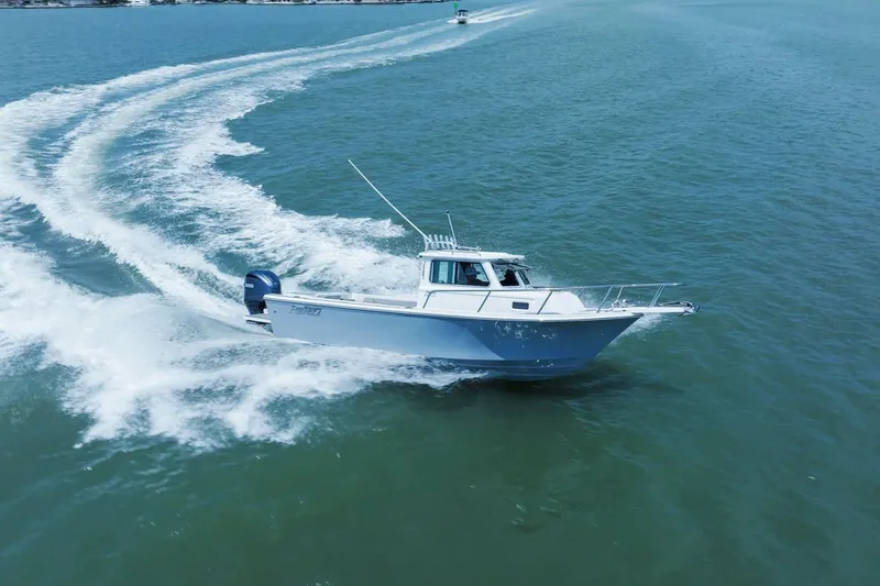 Slide: The Image of Parker 2320 Sport Cabin 2024 cruising swiftly on the ocean. - 15