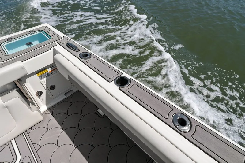 Slide: The Image of Parker 2320 Sport Cabin 2024, boat cabin overlooking the water. - 26