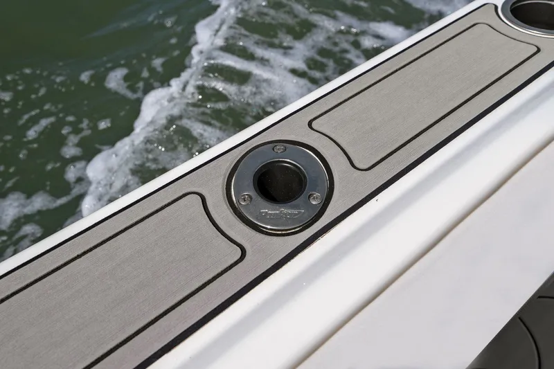 Slide: The Image of Parker 2320 Sport Cabin 2024, boat detail by the water. - 29