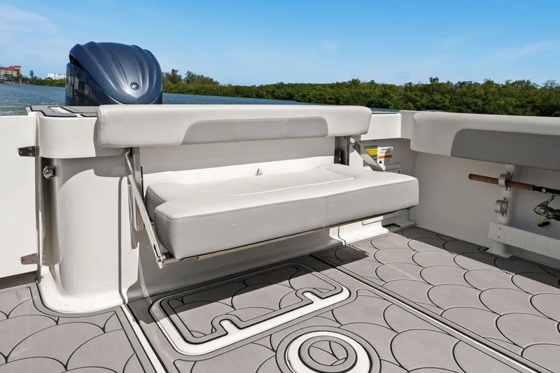 Slide: The Image of Parker 2320 Sport Cabin 2024 with foldable seat and outboard motor. - 34