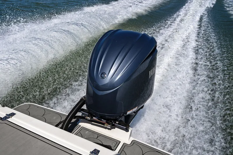 Slide: The Image of Parker 2320 Sport Cabin 2024 with Yamaha outboard motor on water. - 37