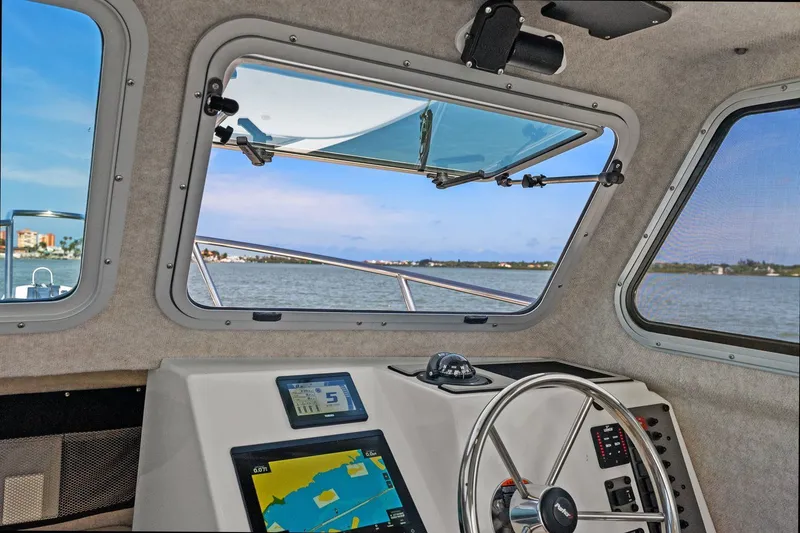 Slide: The Image of Interior view of 2024 Parker 2320 Sport Cabin overlooking the water. - 44