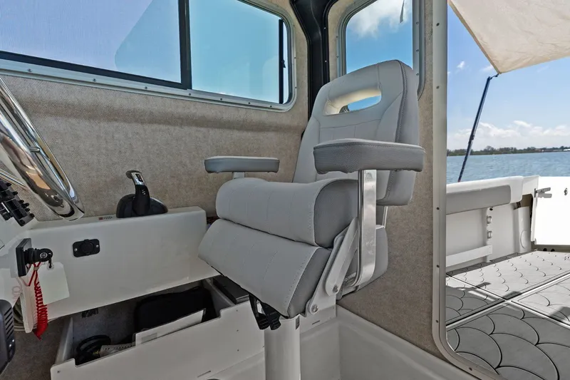 Slide: The Image of Interior of 2024 Parker 2320 Sport Cabin with captain's chair. - 45