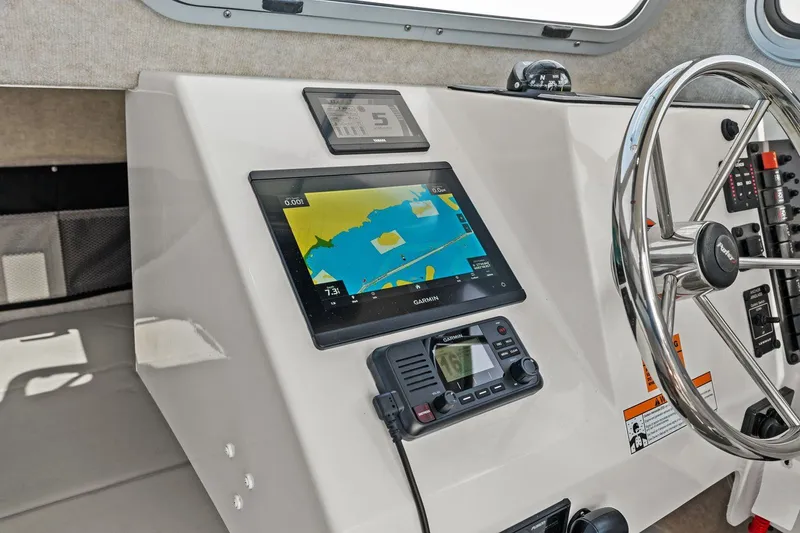 Slide: The Image of Interior of 2024 Parker 2320 Sport Cabin with navigation system. - 46