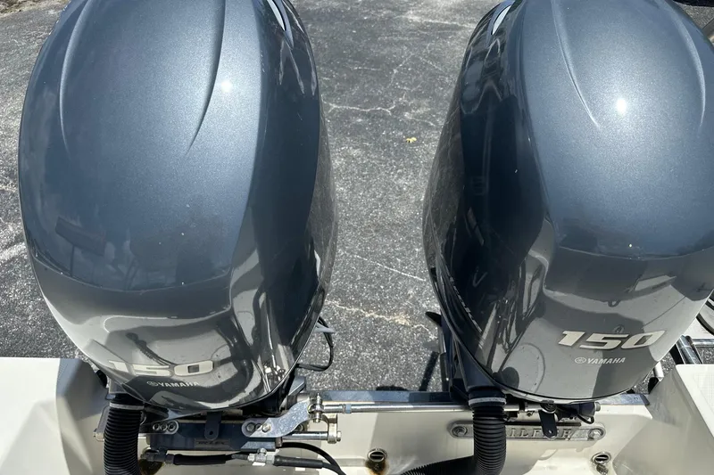 Slide: The Image of Twin Yamaha 150 outboard engines on a 2015 Sailfish 275 DC boat. - 37