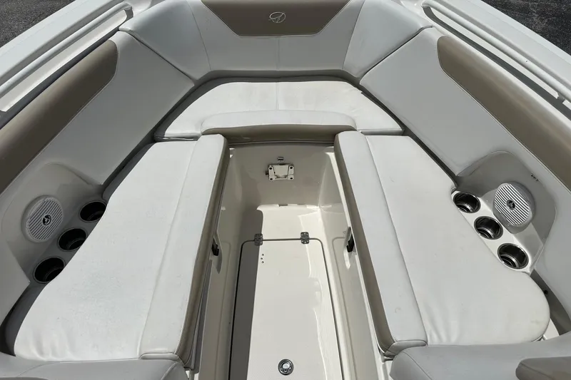 Slide: The Image of Spacious seating area on a 2015 Sailfish 275 DC boat with cup holders and speakers. - 14