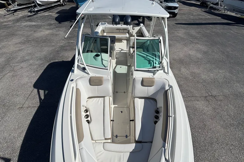 Slide: The Image of 2015 Sailfish 275 DC boat with spacious seating and dual consoles. - 4