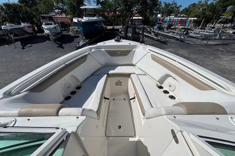 Slide: The Image of 2015 Sailfish 275 DC boat interior with spacious seating and cup holders. - 5