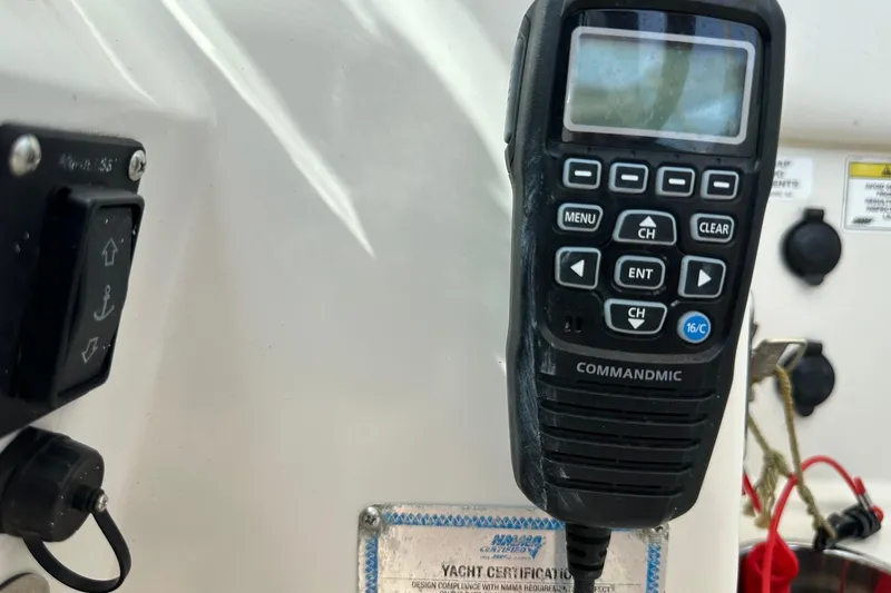 Slide: The Image of Close-up of a CommandMic radio on a 2015 Sailfish 275 DC boat. - 29