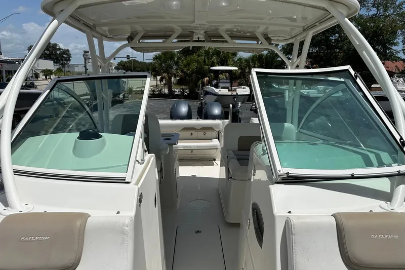 Slide: The Image of 2015 Sailfish 275 DC boat interior with dual consoles and seating. - 17