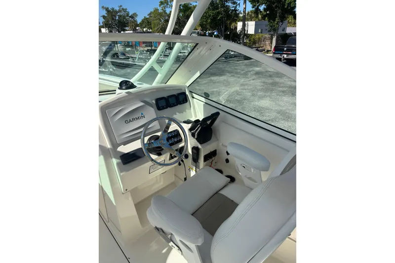 Slide: The Image of Cockpit of 2015 Sailfish 275 DC boat with Garmin navigation system. - 7