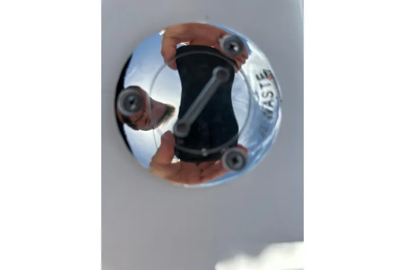 Slide: The Image of Reflection on a shiny metal surface of a 2015 Sailfish 275 DC boat. - 42