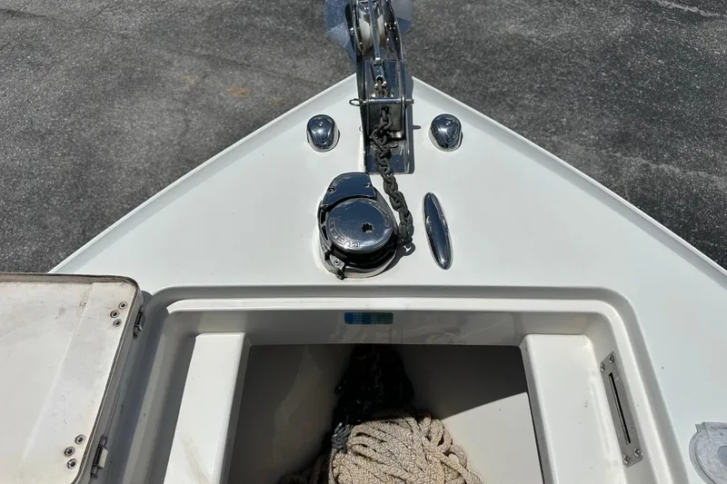 Slide: The Image of Bow of 2015 Sailfish 275 DC boat with anchor chain and storage compartment. - 10