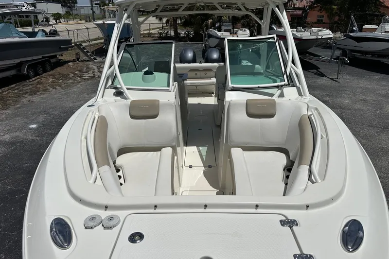 Slide: The Image of 2015 Sailfish 275 DC boat with spacious seating and dual console design. - 11