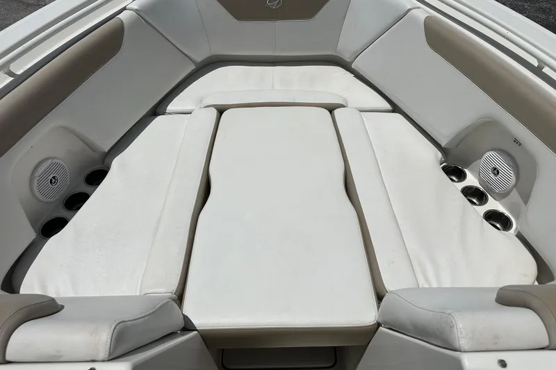Slide: The Image of Interior seating of a 2015 Sailfish 275 DC boat with cup holders and speakers. - 13