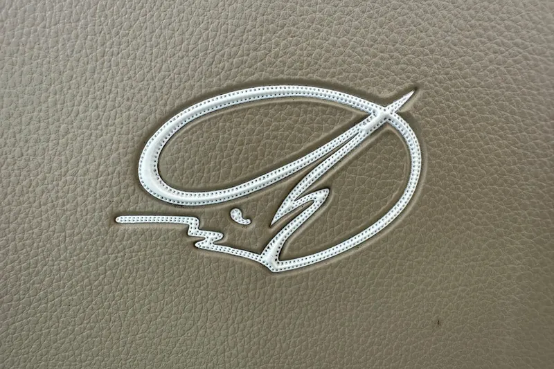 Slide: The Image of Embossed Sailfish logo on brown leather, 2015 Sailfish 275 DC boat interior. - 7