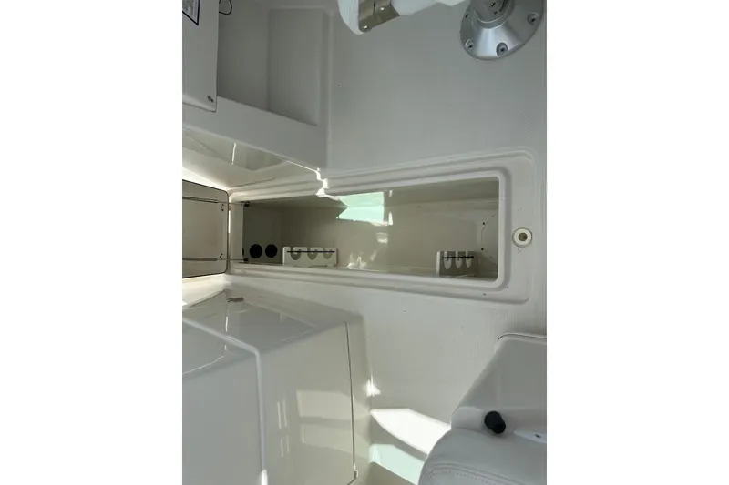 Slide: The Image of Interior view of a 2015 Sailfish 275 DC boat storage compartment. - 35