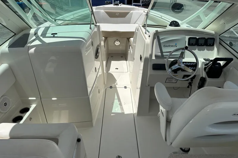 Slide: The Image of Interior of 2015 Sailfish 275 DC boat with Garmin navigation system and seating. - 18