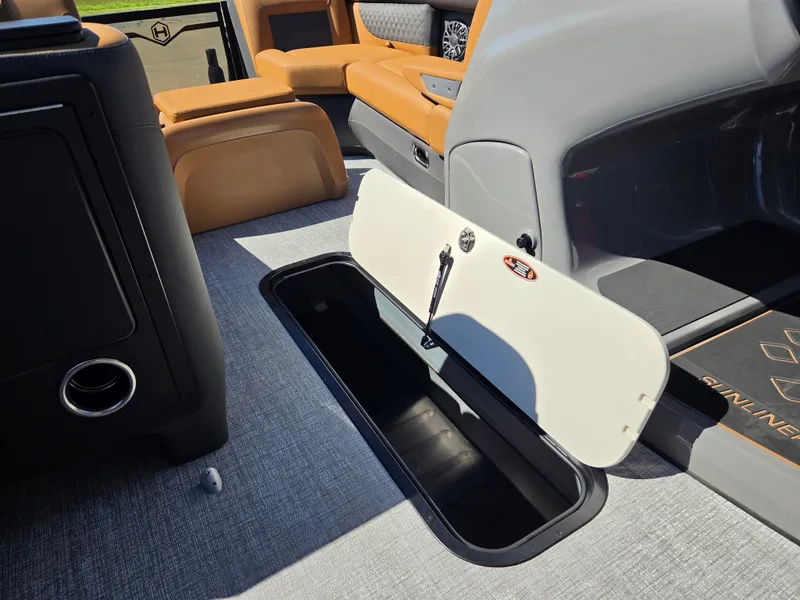 Slide: The Image of Interior of the Harris Sunliner 230 with storage compartment and comfortable seating. - 18