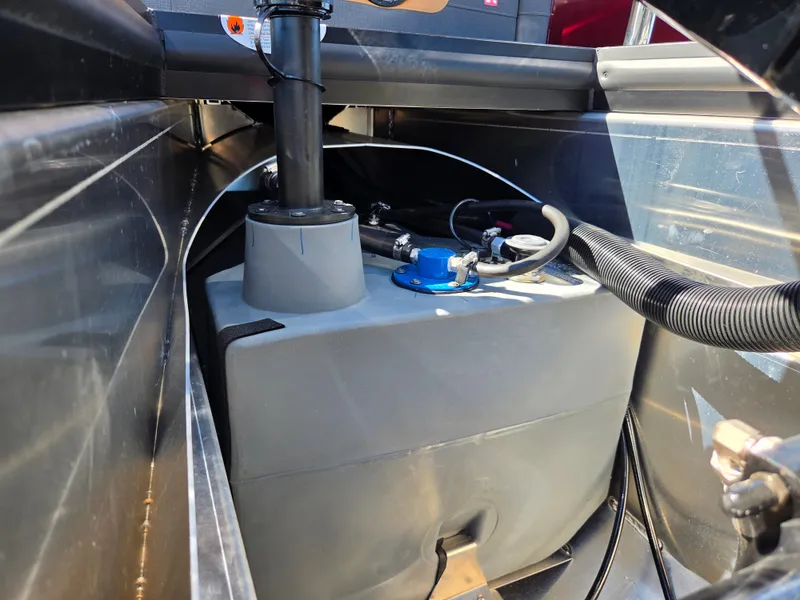 Slide: The Image of A view of the engine compartment of a 2027 Harris Sunliner 230 with visible cables and connections. - 32