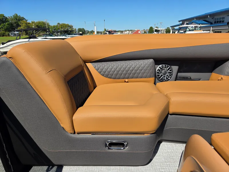 Slide: The Image of The image shows the luxurious interior of a 2027 Harris Sunliner 230 with elegant brown upholstery. - 11