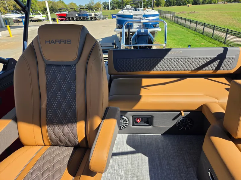 Slide: The Image of The image shows the interior of a 2027 Harris Sunliner 230 with elegant, upholstered seating. - 20