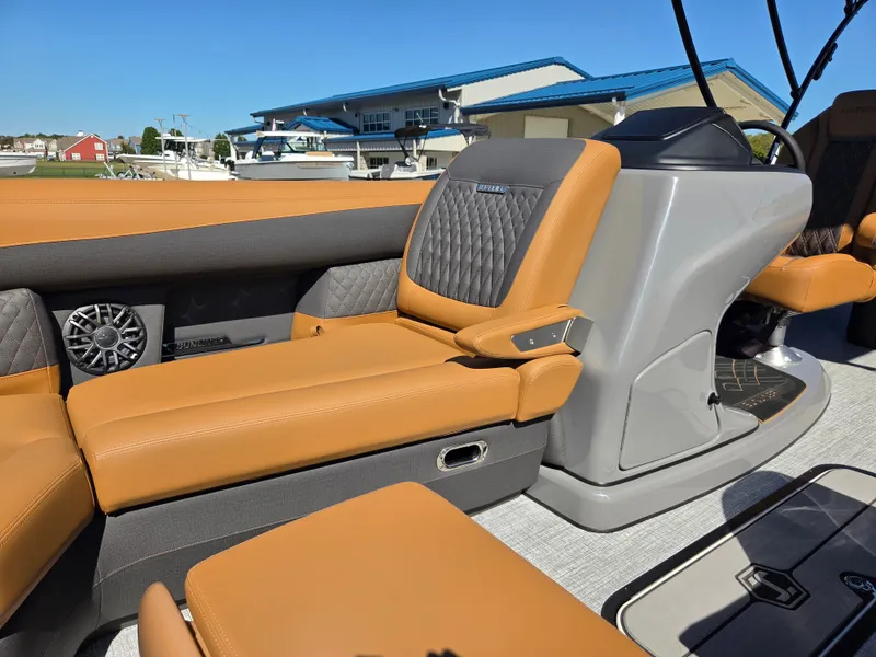 Slide: The Image of The image shows the interior of a 2027 Harris Sunliner 230 with sleek leather seating. - 12