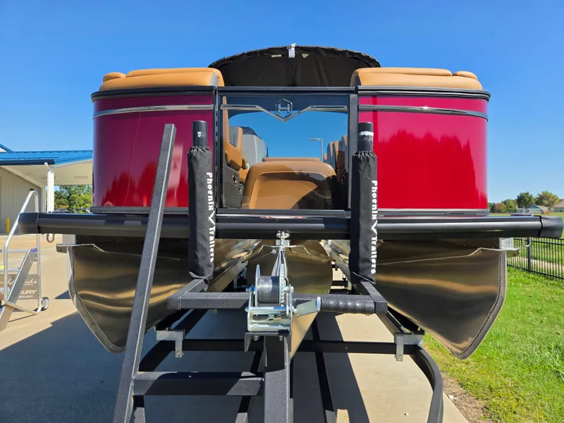 Slide: The Image of A 2027 Harris Sunliner 230 pontoon boat with a red hull and beige interior. - 4