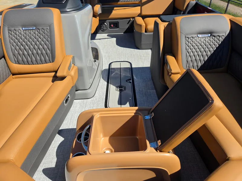 Slide: The Image of Interior of a 2027 Harris Sunliner 230 with luxurious brown and gray seating. - 10