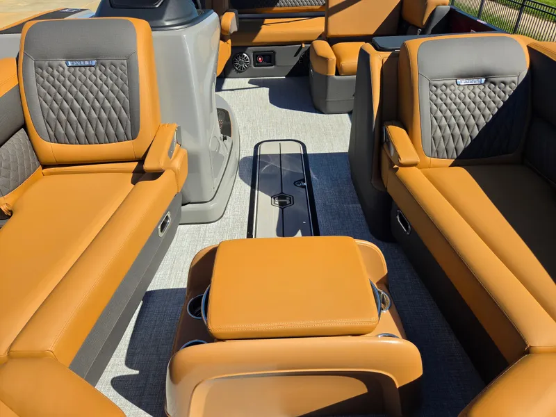 Slide: The Image of Interior of a 2027 Harris Sunliner 230 with luxurious brown leather seating. - 9