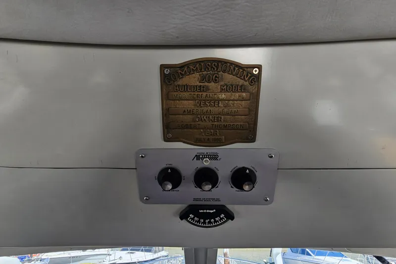 Slide: The Image of Plaque and control panel on 1990 Mediterranean 38 Convertible boat interior. - 25