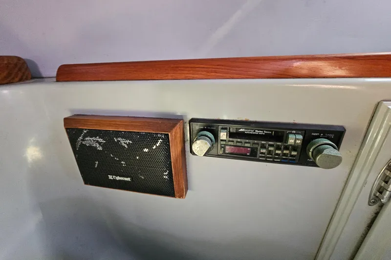 Slide: The Image of Vintage marine stereo and speaker on a 1990 Mediterranean 38 Convertible boat. - 31