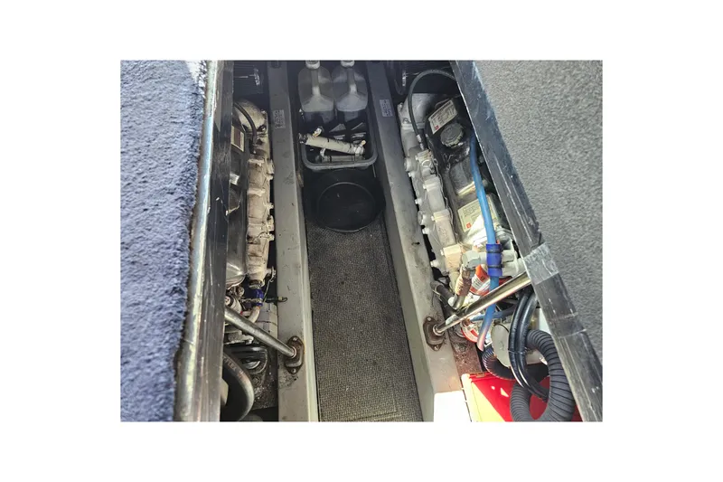 Slide: The Image of Engine compartment of a 1990 Mediterranean 38 Convertible boat, showcasing mechanical components. - 41