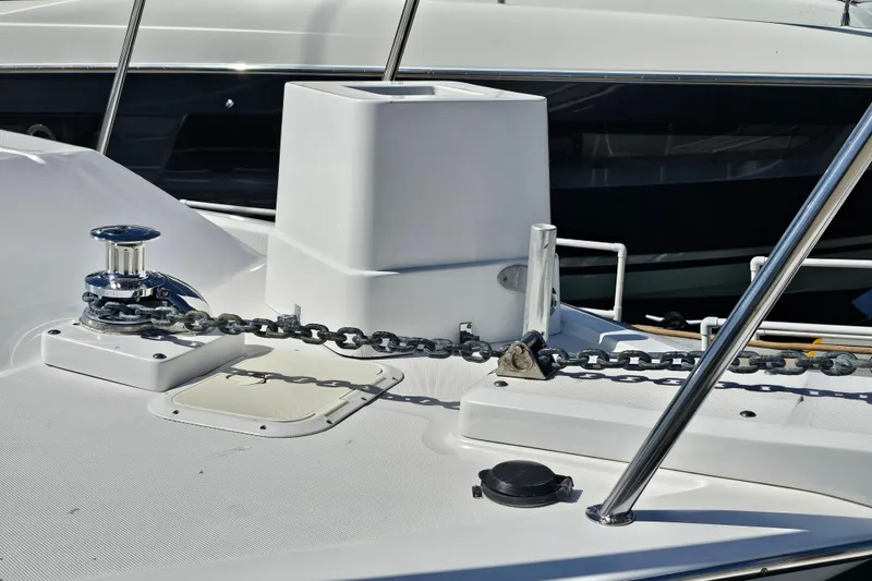 Slide: The Image of Deck of 1990 Mediterranean 38 Convertible yacht with anchor chain and winch. - 5