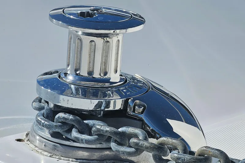 Slide: The Image of Chrome winch with chain on 1990 Mediterranean 38 Convertible yacht. - 6