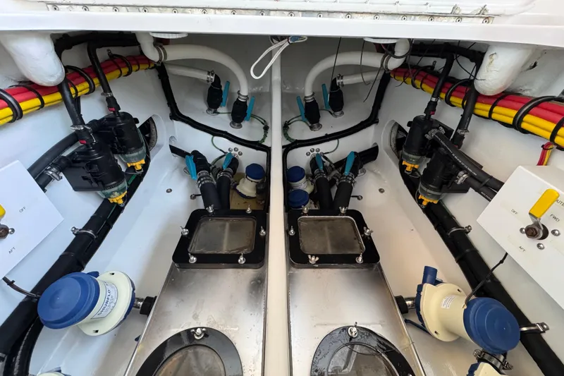 Slide: The Image of Engine compartment of a 2022 Nor-Tech 392 Super Fish, showcasing detailed mechanical components. - 12