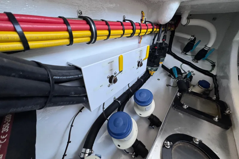 Slide: The Image of 2022 Nor-Tech 392 Super Fish engine compartment with wiring and control panel. - 14