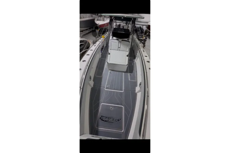 Slide: The Image of 2022 Nor-Tech 392 Super Fish boat on a lake under a clear blue sky. - 8
