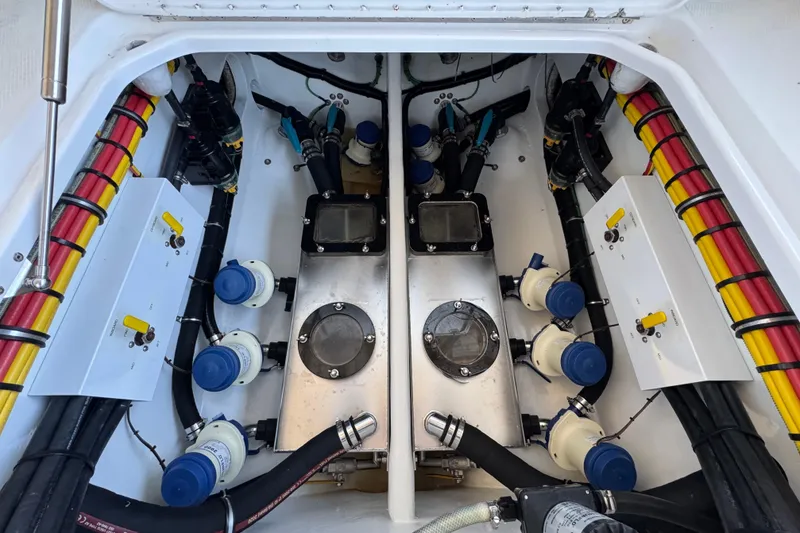 Slide: The Image of Engine compartment of a 2022 Nor-Tech 392 Super Fish, showcasing detailed mechanical components. - 11