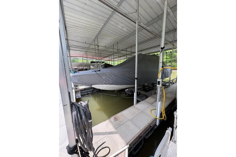 Slide: The Image of Covered 2022 Nor-Tech 392 Super Fish boat docked in a sheltered marina. - 15