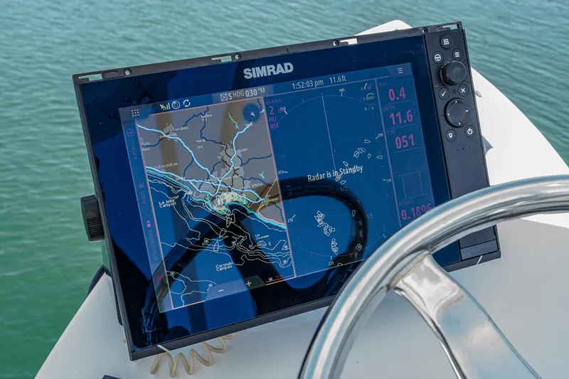 Slide: The Image of Simrad navigation display on 2019 Fountain 38 CC boat, showing radar and map. - 10